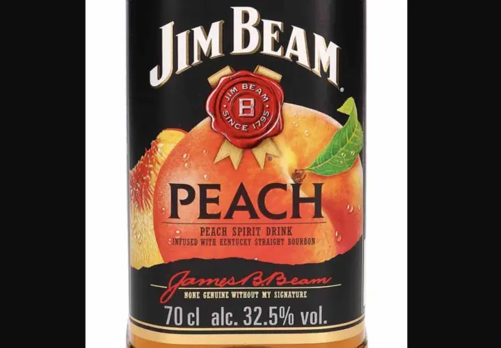 Butelka Jim Beam Peach z brzoskwinią i liściem.